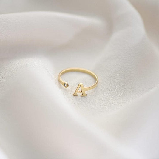 INITIAL TINY RING GOLD PLATED